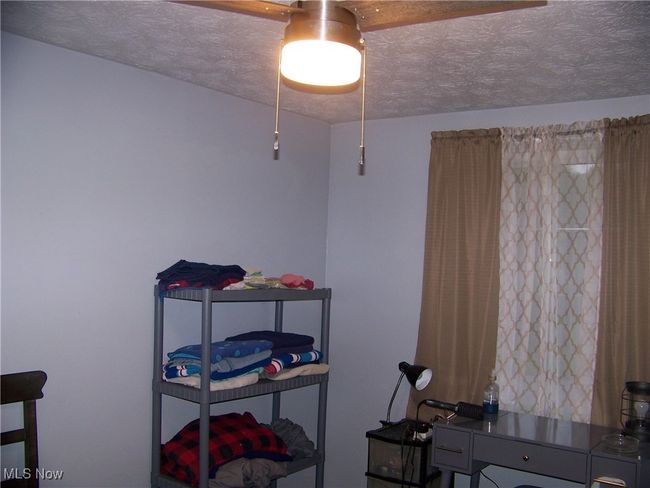 Bedroom featuring a textured ceiling | Image 16