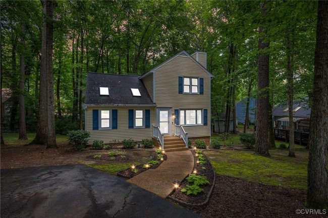 View of front facade with a chimney and a shingled roof | Image 6