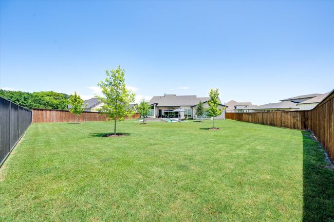 View of yard featuring a fenced backyard | Image 38