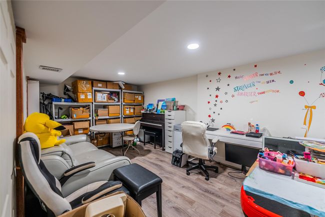 Office space with wood finished floors and recessed lighting | Image 33