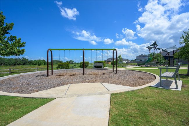 Community play area featuring a yard | Image 28