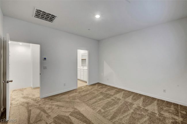 Carpeted empty room with recessed lighting, visible vents, and baseboards | Image 33