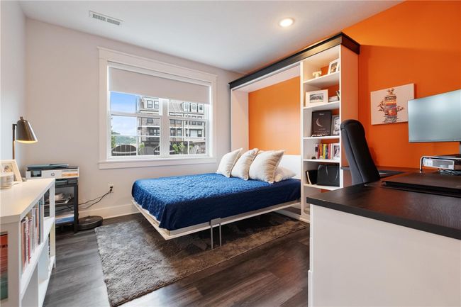 A second Home Office in the Lower Level with a built-in desk, bookcase and a Murphy bed that folds up and tucks away! Great to have for guests or could be used as a 5th BR. | Image 40