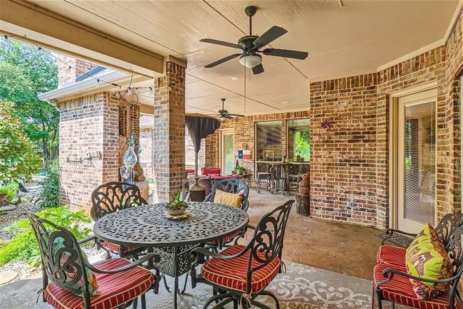 View of patio / terrace featuring ceiling fan and outdoor dining space | Image 28