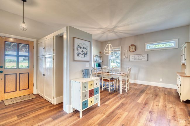 Entrance foyer featuring light wood-type flooring and a chandelier | Image 5