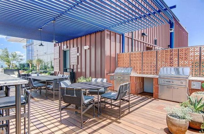 Deck with outdoor dining space and an outdoor kitchen | Image 22