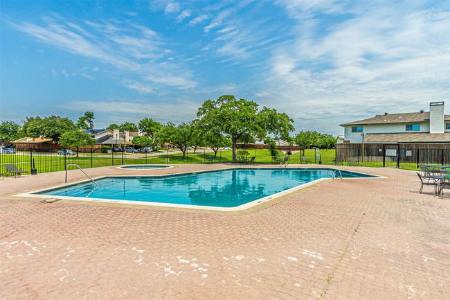 Community pool featuring a community clubhouse and patio | Image 25