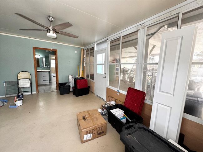Florida room off the other side of the kitchen at the back of the house | Image 39
