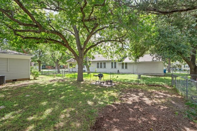 Shaded yard with mature trees and shed | Image 31