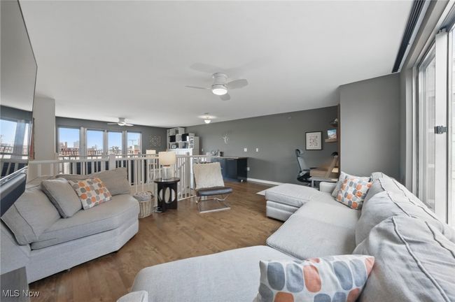 Living area featuring wood finished floors and a ceiling fan | Image 35