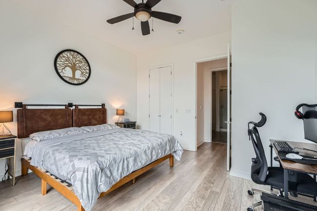Bedroom with baseboards, ceiling fan, a closet, and light wood finished floors | Image 14