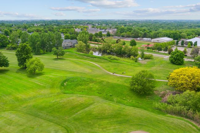 An unbeatable location—directly across from prestigious Shattuck-St. Mary’s School and backing to Legacy Golf Course! | Image 6