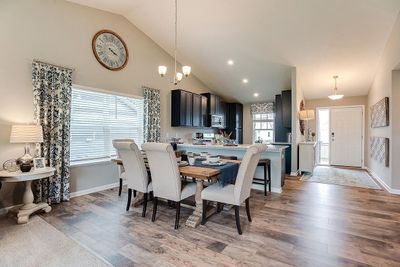 Open concept living at it's best with the vaulted main level ceilings! Photos of model home. Colors and options may vary. Ask Sales Agent for details. | Image 3