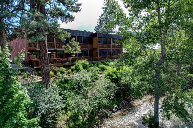 Smell and hear the rushing river flow by the back decks of the units and common areas- year round. | Image 5
