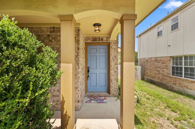 Property entrance with brick siding | Image 4