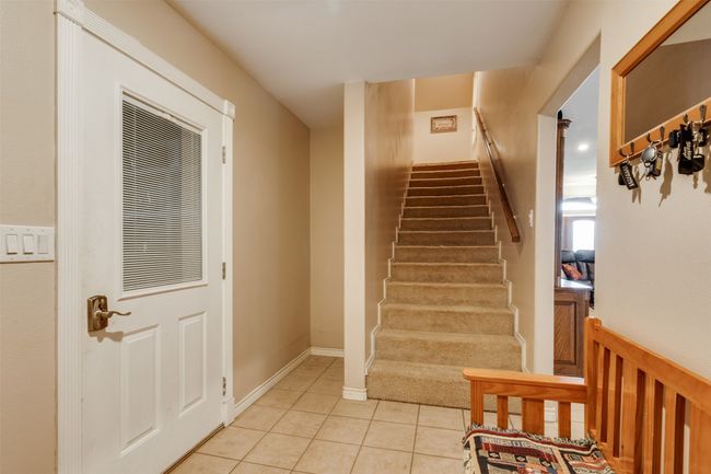 Stairway featuring tile patterned flooring | Image 26
