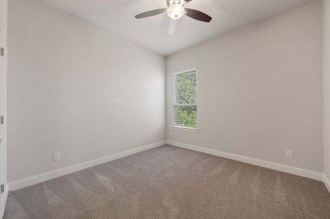 Spare room with ceiling fan, carpet flooring, and baseboards | Image 28