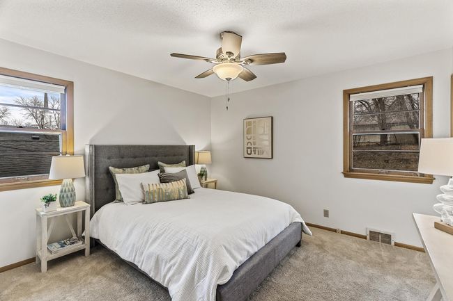Primary Bedroom in the SE corner of the home, features a private 1/2 bath and overlooks the backyard | Image 16