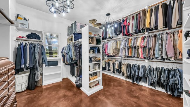 Spacious closet featuring a chandelier | Image 33