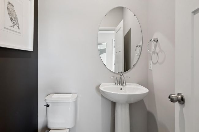 (Photo of decorated model, actual home's finishes will vary) This powder bath is conveniently located on the main level. | Image 12