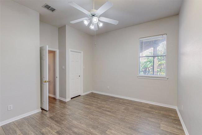 Unfurnished room featuring wood finished floors, baseboards, and ceiling fan | Image 30