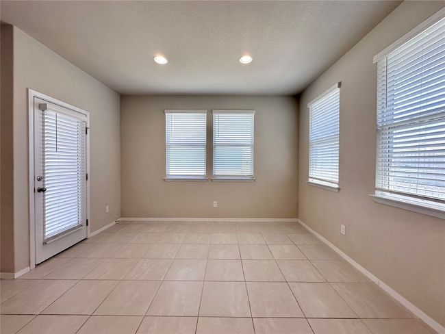 Spare room featuring recessed lighting and light tile patterned floors | Image 8