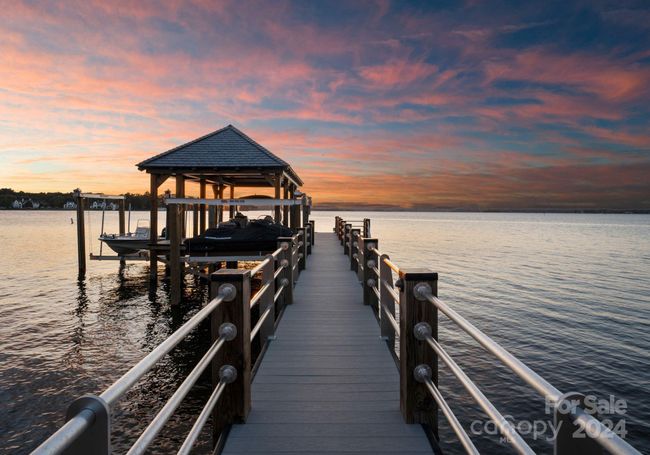 The private and fixed dock features two boat lifts as well as two jet ski lifts. | Image 42