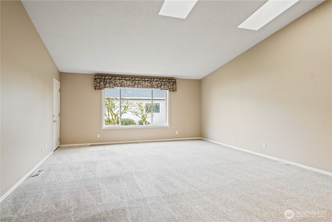 Spacious living room with skylights | Image 4