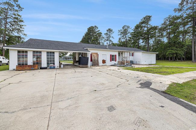 Single story home with driveway and a front lawn | Image 28