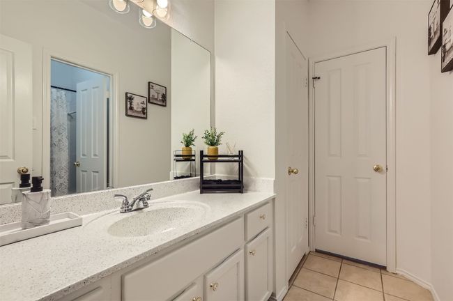 Full bathroom with vanity and tile patterned floors | Image 22