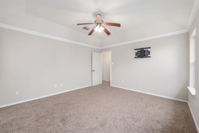a ceiling fan, baseboards, ornamental molding | Image 11
