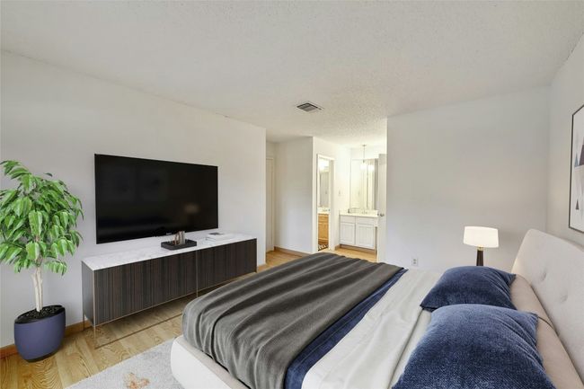 Primary bedroom has direct access to bathroom and large walk in closet. | Image 11