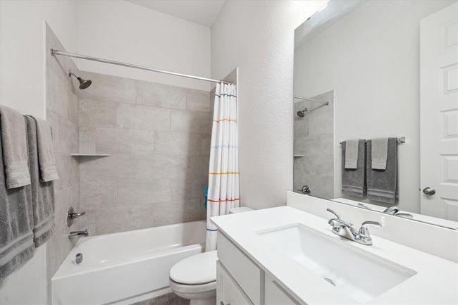 The guest bathroom mirrors the home’s classic style, combining functionality with timeless elegance to create a spacious, convenient, and polished space. | Image 26
