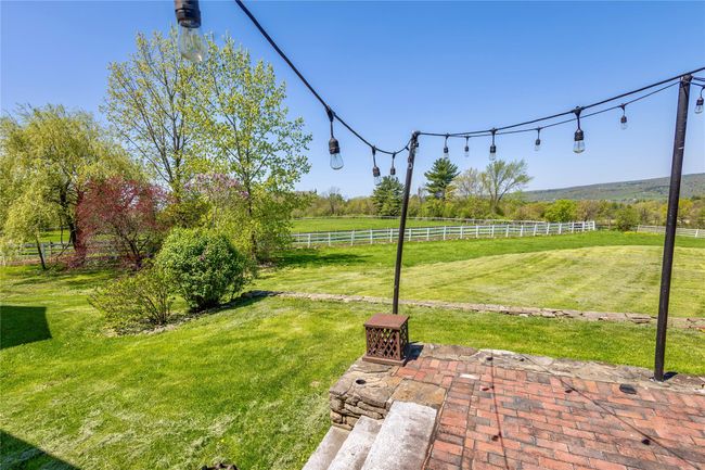 View of yard featuring a view of countryside and a patio | Image 7