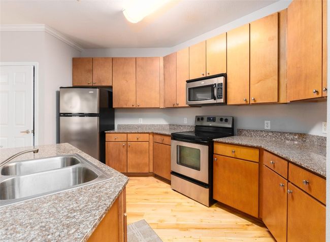 Remarkable kitchen in the corner unit floorplan! | Image 4