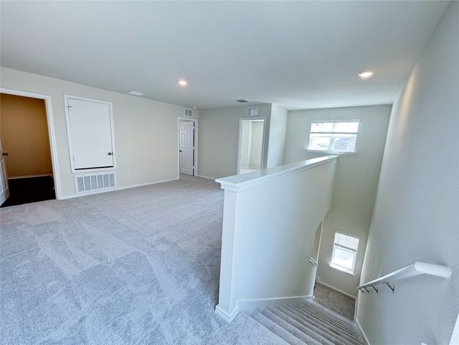 Stairs with carpet flooring, baseboards, and recessed lighting | Image 13