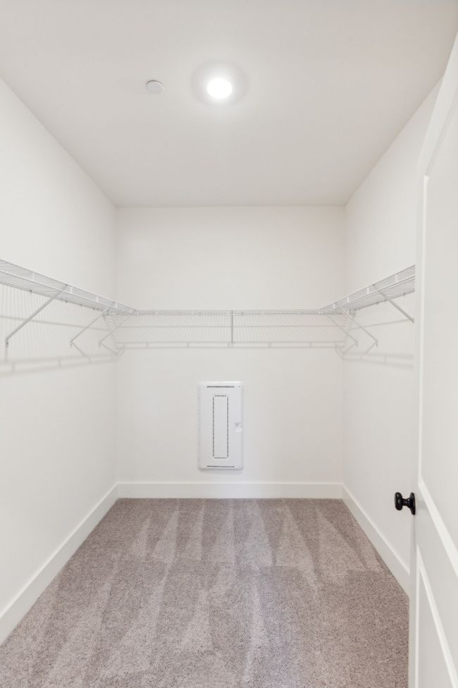Tired of having more stuff than places to put it? Your oversized walk-in closet would love to help! Actual photo of home. | Image 25