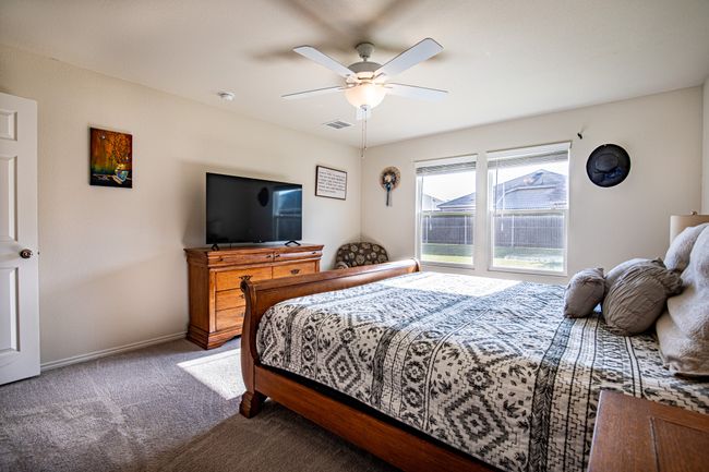 Bedroom featuring carpet flooring and a ceiling fan | Image 18
