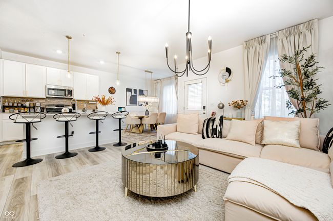 living room featuring recessed lighting, an inviting chandelier, and light wood-style floors | Image 5
