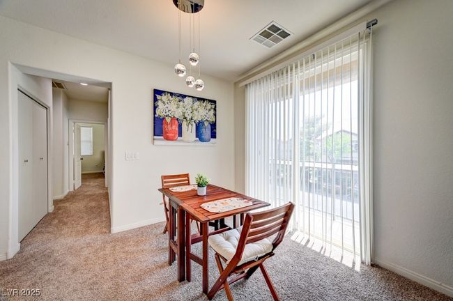 Dining space with light colored carpet | Image 7