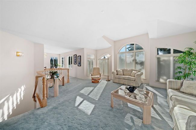 Expansive living areas, fresh neutral tones, and large, bright windows that flood the home with natural light! | Image 15