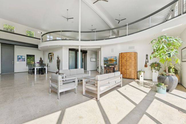 View of patio with a balcony and an outdoor hangout area | Image 13