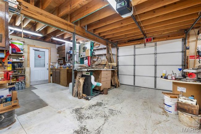 Garage with a garage door opener | Image 44