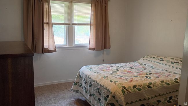 Carpeted bedroom with baseboards | Image 25