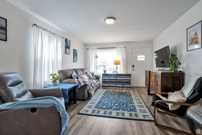 Living area with wood finished floors | Image 6