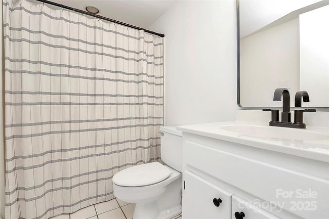 Full bath on the main with tub/shower combo adds value and ease to home's value providing use for guests or multi-generational living. | Image 8