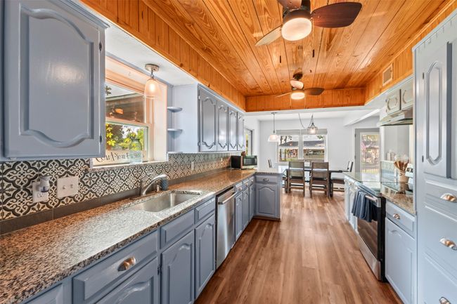 Thoughtful Layout with Lake Views from Kitchen | Image 13