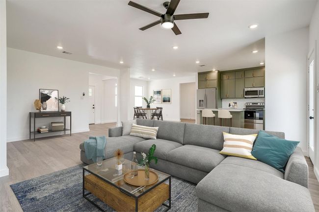 Living area featuring recessed lighting, baseboards, a ceiling fan, and light wood-type flooring | Image 4