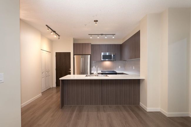 102 - 1152 Windsor Mews, Condo with 3 bedrooms, 2 bathrooms and 2 parking in Coquitlam BC | Image 16