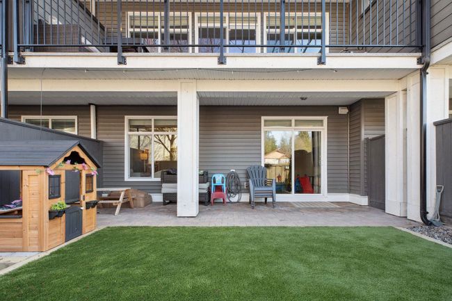 Rear view of property with a patio area and a yard | Image 36